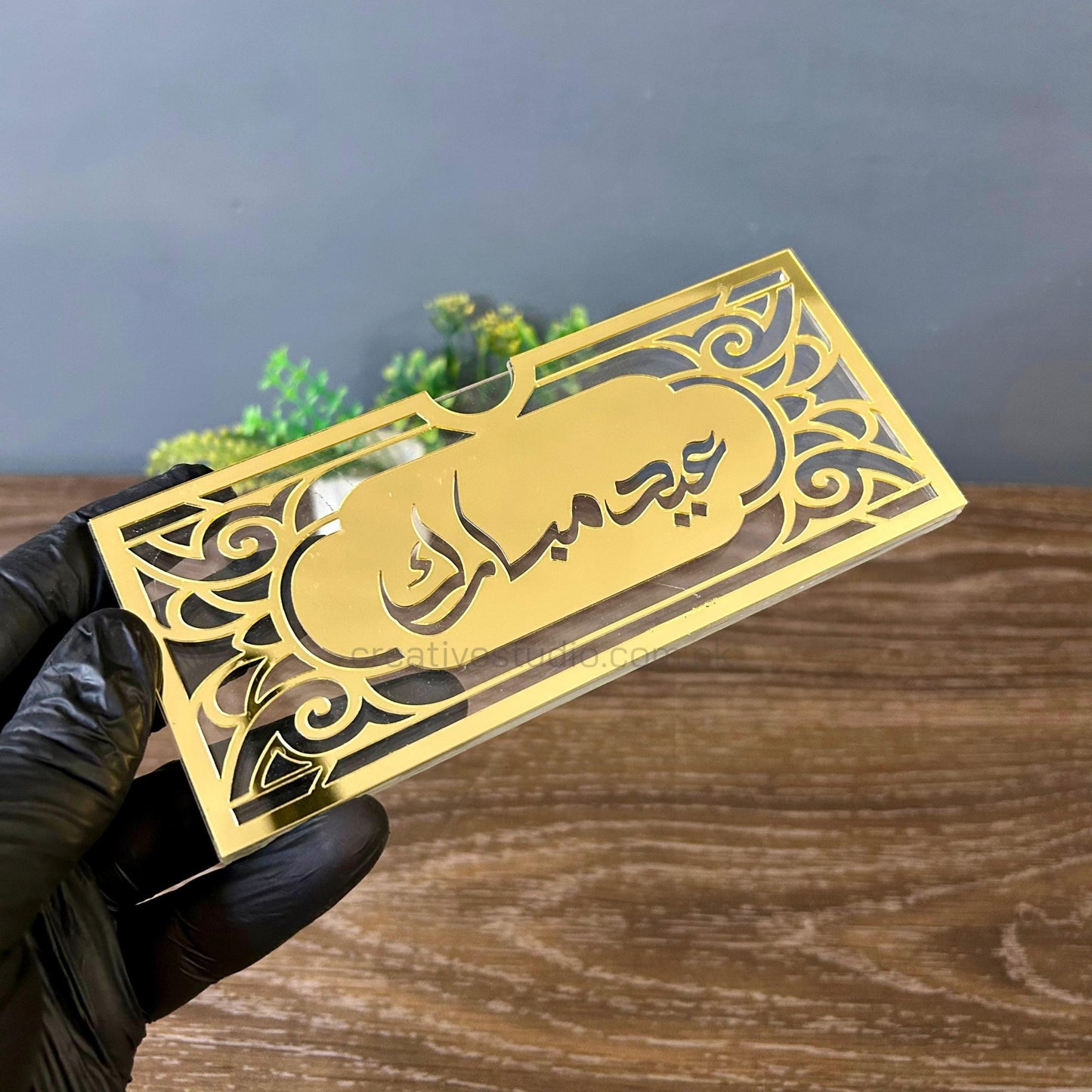 ظرف عيد أكريليك ذهبي مرآة للهدايا ©